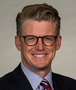 Justin E.  Brown